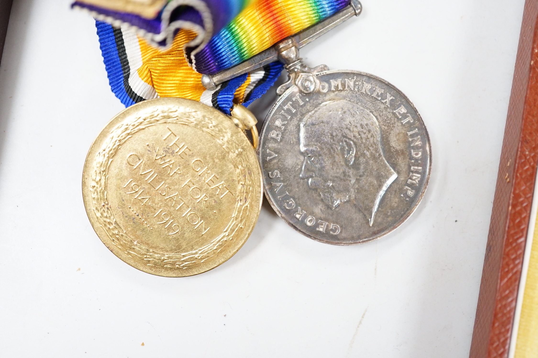 A cased presentation medal, together with a WWI medal pair and a cased RMS Lusitania medallion